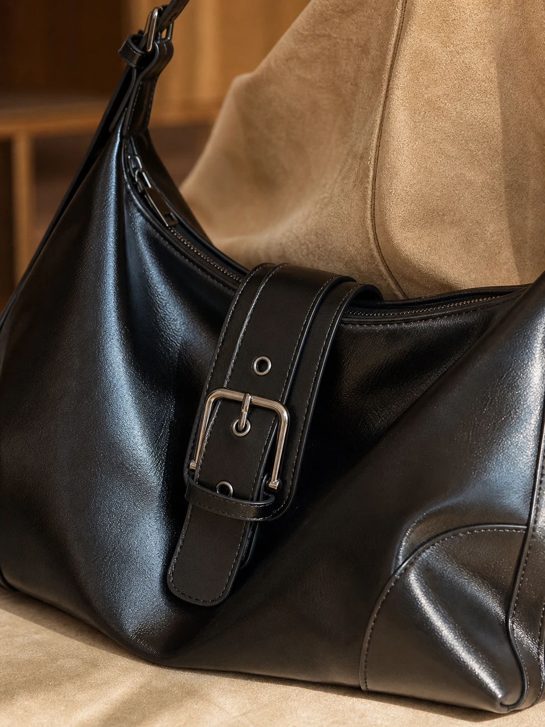 Close up of glossy leather texture stitching zipper and metal buckle