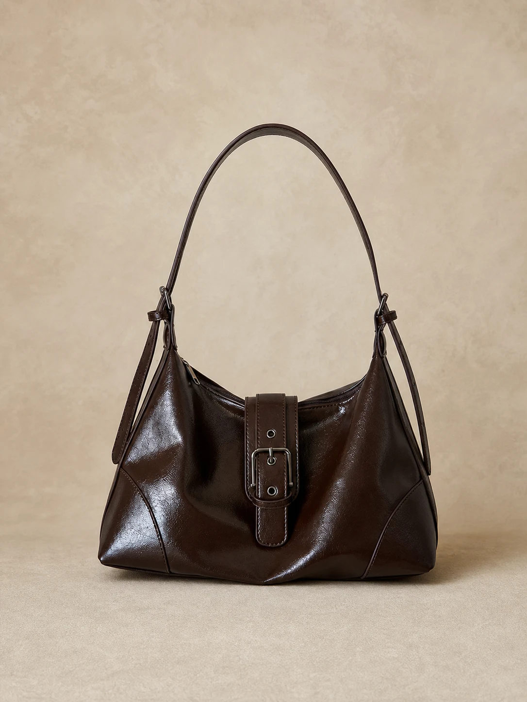 Dark brown glossy buckle underarm shoulder bag front view