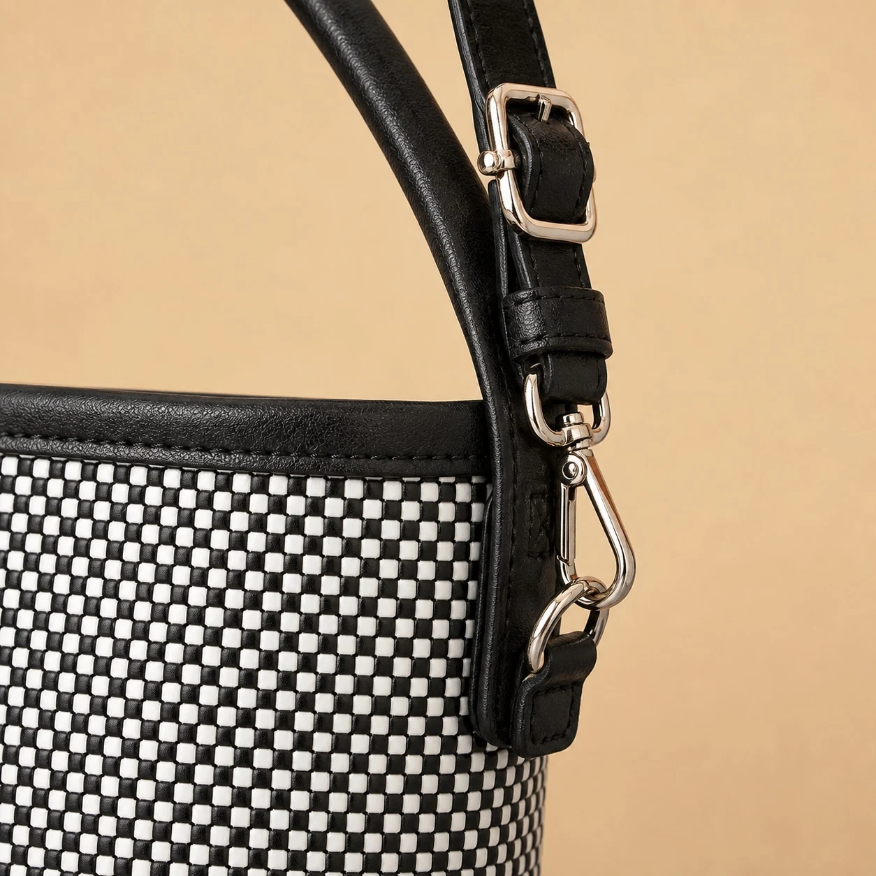 Close up of woven texture leather trim and metal hardware