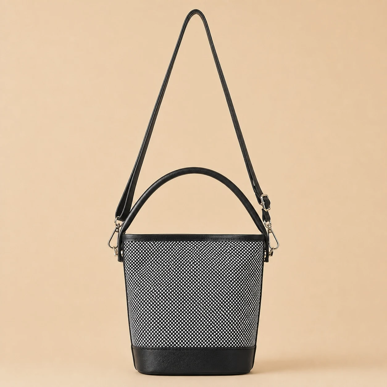 Black and white woven bucket shoulder bag front view
