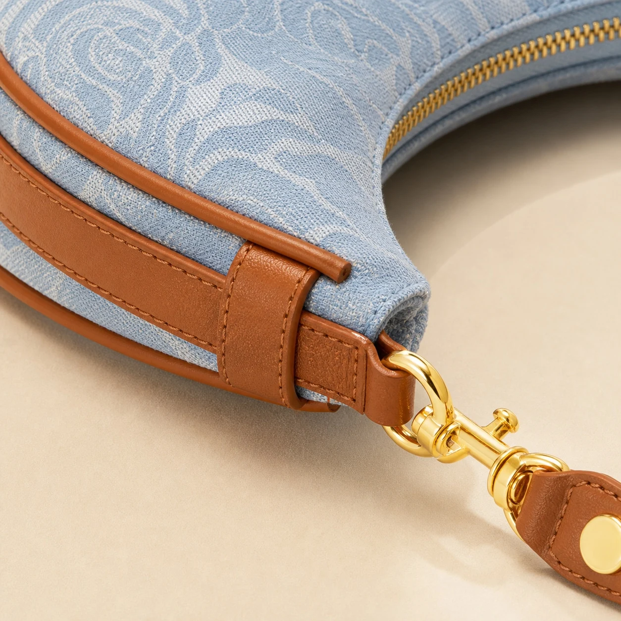 Floral fabric, brown trim, and hardware detail