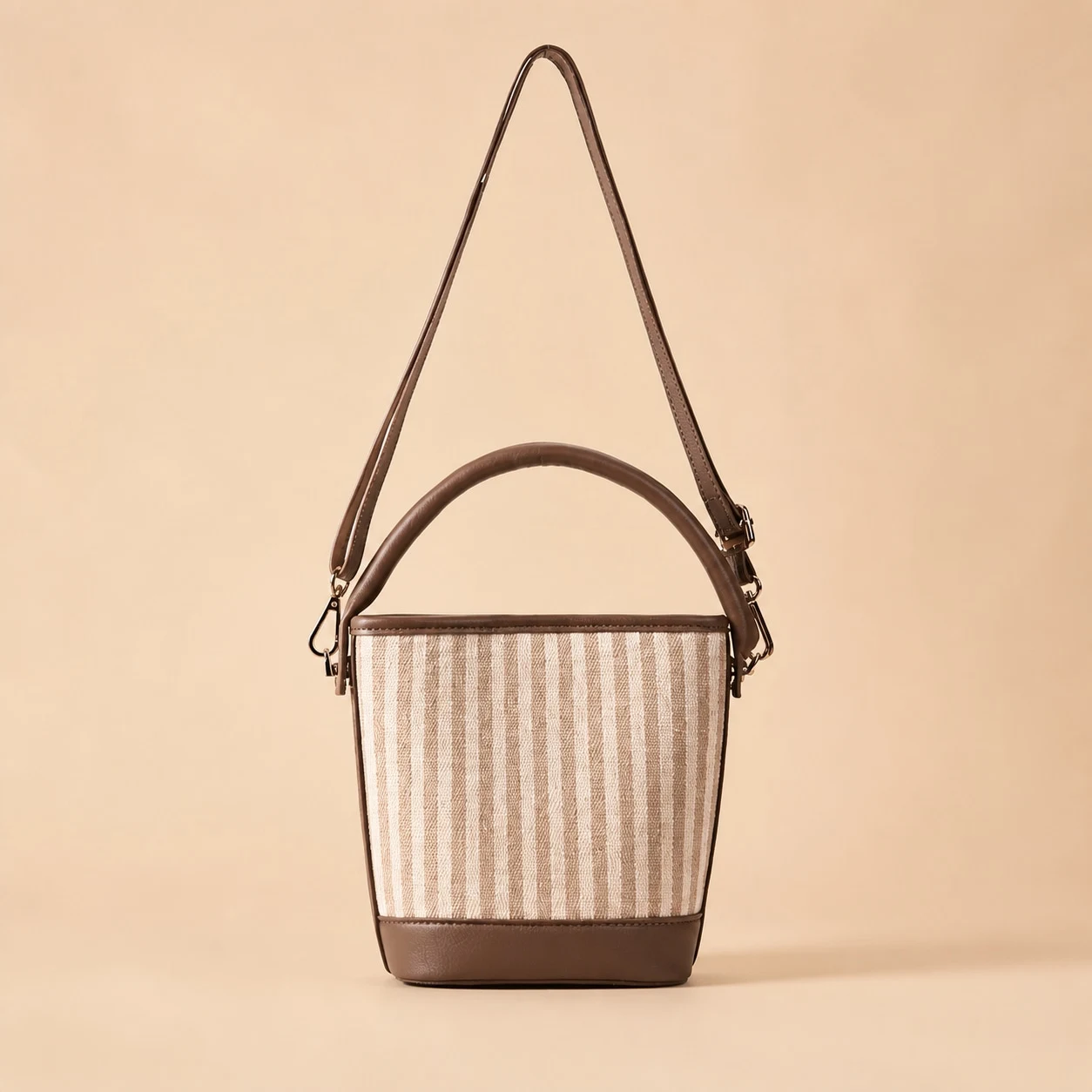 Beige and brown woven bucket shoulder bag front view