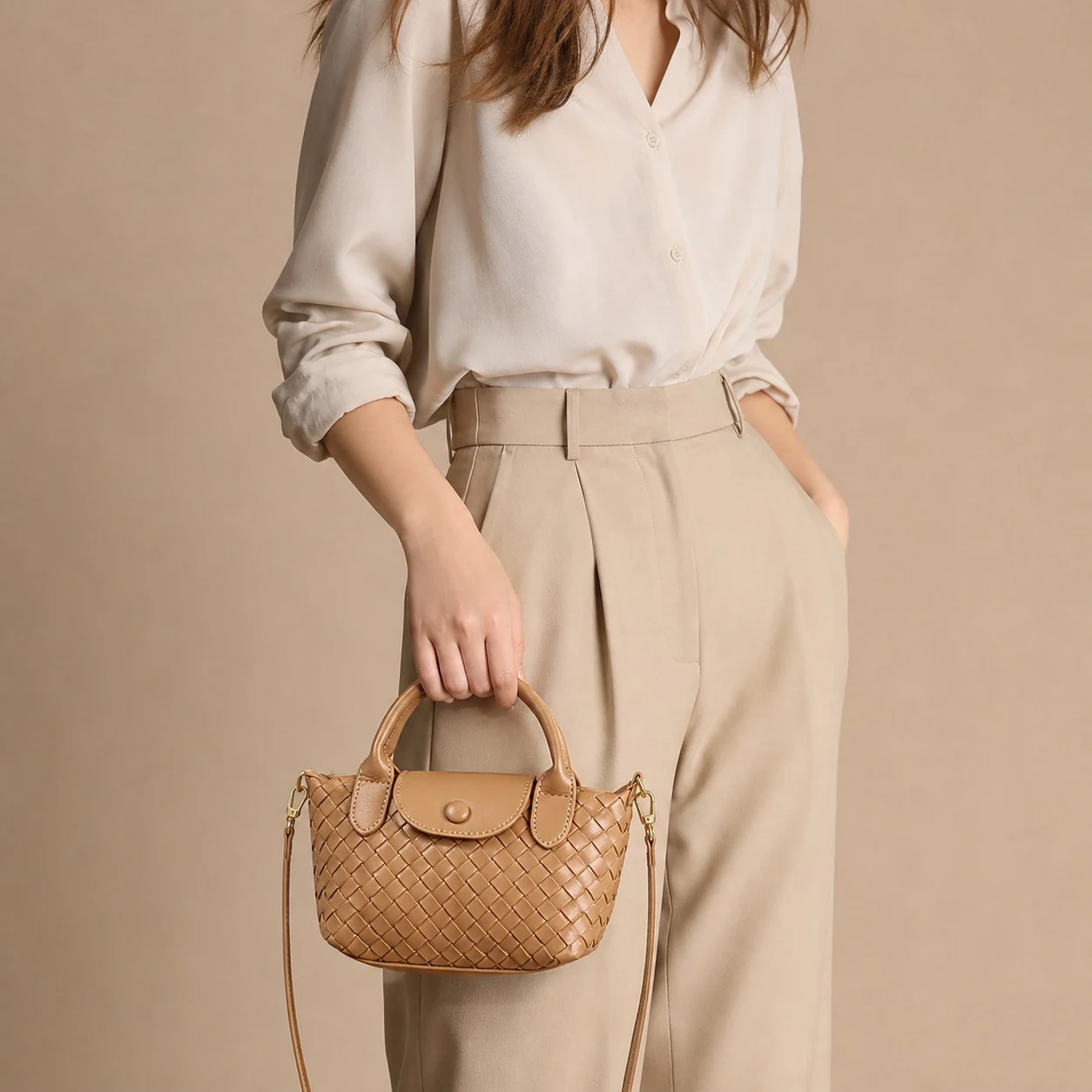 Tan woven satchel hand carry styling